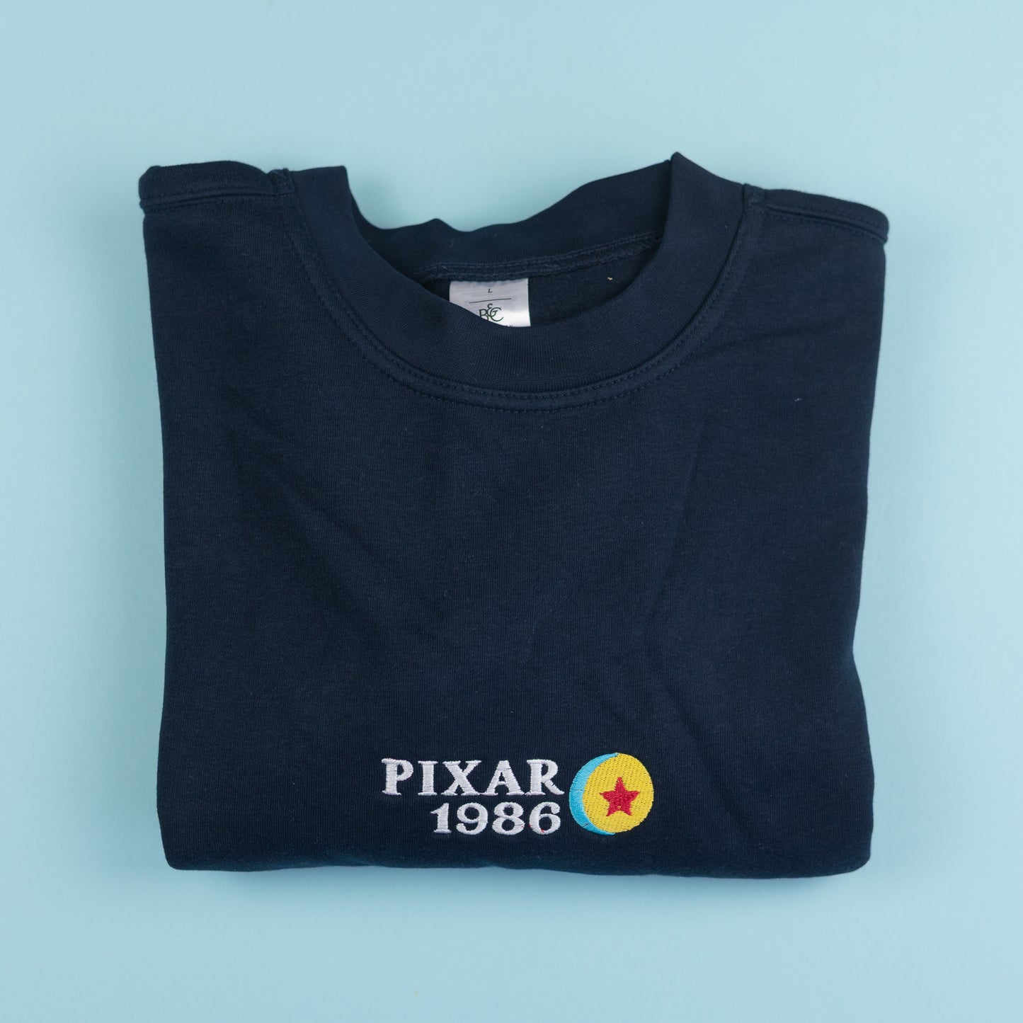 Sample - Pixar 1986 Navy Embroidered Jumper